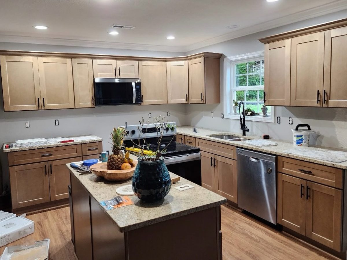 Before: the same kitchen with bare painted walls